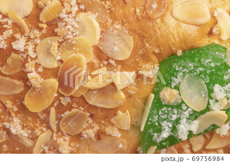 Spanish typical Epiphany cake Roscon de Reyes with fruit, background 69756984