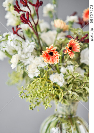 Series, step by step installation of flowers in a vase. Flowers bunch, set for home. Fresh cut flowers for decoration home. European floral shop. Delivery fresh cut flower. 69757272