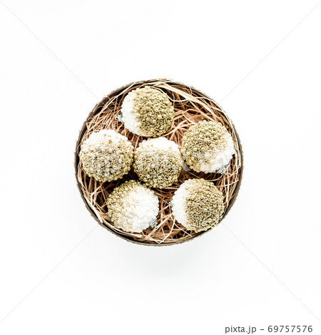christmas wreath frame made of colored bright golden christmas balls on white background. flat lay, top view 69757576