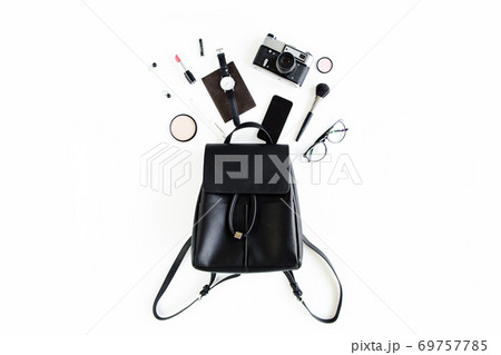 Women's beige backpack with fashion accessories on white background top view. Flat lay female style look. Top view. Women's beige backpack with fashion accessories on white background top view. Flat lay female style look. Top view. 69757785