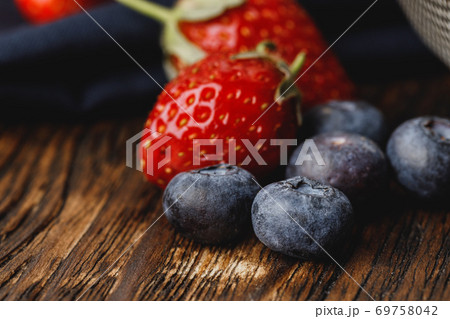 Close up photo of blueberries and strawberries Close up photo of blueberries and strawberries 69758042