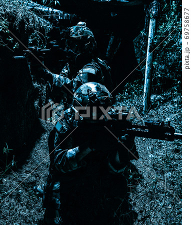 Navy SEALs team shooters moving in trench 69758677