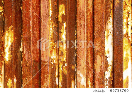 Old rusty fence made of corroded galvanized material. Bright abstract texture Old rusty fence made of corroded galvanized material. Bright abstract texture 69758760