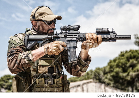 Private military company mercenary with gun 69759178