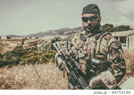 Portrait of equipped, armed US Navy SEALs fighter 69759190