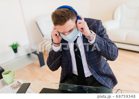 Photo of young businessman with notebook freelance job internet, medical mask Photo of young businessman with notebook freelance job internet, medical mask 69759348