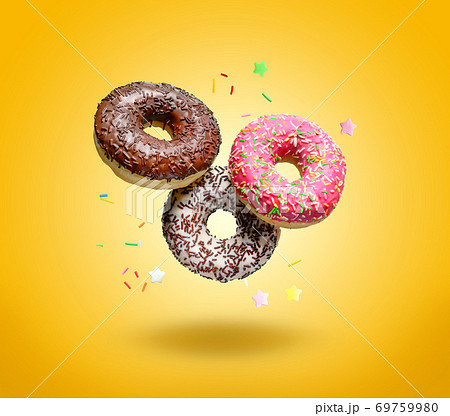 Flying donuts on yellow background. 69759980