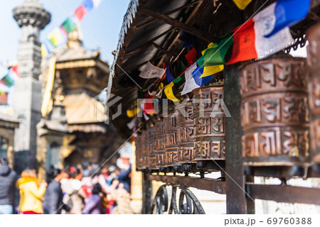 Prayer wheels at Boudhanath Stupa in Kathmandu, Nepal 69760388