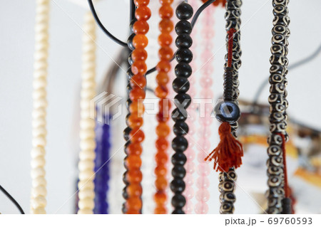 Gemstone and pearl necklaces in a jewellery shop 69760593