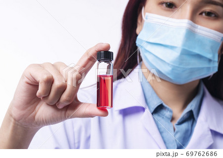 Hand of young woman doctor wear uniform white clothes and medical mask protection virus disease 69762686