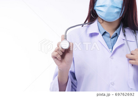 Close up hand of young woman doctor or nurse wear coat uniform and face mask 69762692