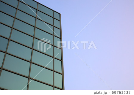 office building blue green background square windows skyscraper 69763535