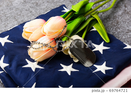 Traditional folded of America United States flag, tag and tulip flower 69764721