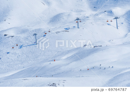 Panoramic view of ski chair lift in high mountains in Switzerland Panoramic view of ski chair lift in high mountains in Switzerland 69764787