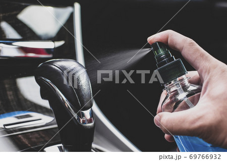 Cleaning gear lever with alcohol sanitizing spray Cleaning gear lever with alcohol sanitizing spray 69766932