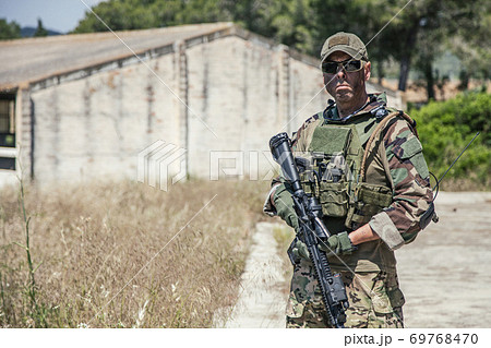 Portrait of equipped, armed US Navy SEALs fighter 69768470