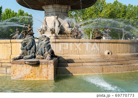 Historical fontaine de la Rotonde with sculpture of lions in Aix-en-Provence Historical fontaine de la Rotonde with sculpture of lions in Aix-en-Provence 69770773