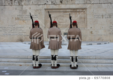 Evzones, the honorary Greek Presidentiial Guard, at the Tomb of the Unknown Soldier. Center of Athens Greece, Syntagma Square. Evzones, the honorary Greek Presidentiial Guard, at the Tomb of the Unknown Soldier. Center of Athens Greece, Syntagma Square. 69770808