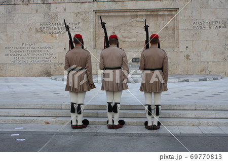 Evzones, the honorary Greek Presidentiial Guard, at the Tomb of the Unknown Soldier. Center of Athens Greece, Syntagma Square. Evzones, the honorary Greek Presidentiial Guard, at the Tomb of the Unknown Soldier. Center of Athens Greece, Syntagma Square. 69770813