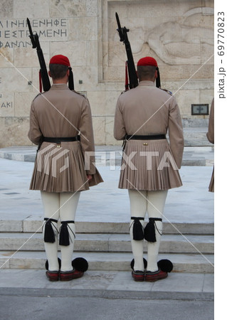 Evzones, the honorary Greek Presidentiial Guard, at the Tomb of the Unknown Soldier. Center of Athens Greece, Syntagma Square. 69770823