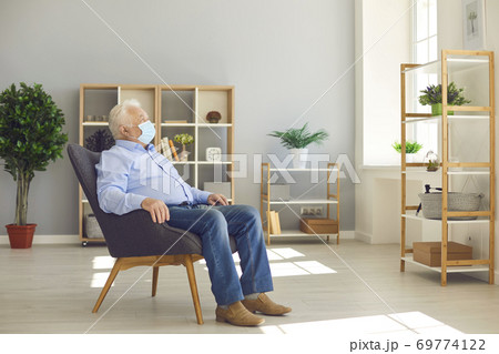 Elderly man, as risk group member, staying at home and not going outside caring about his health Elderly man, as risk group member, staying at home and not going outside caring about his health 69774122