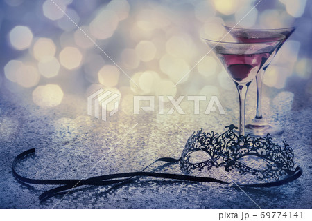 carnival mask and glasses with glittering background and copy space 69774141