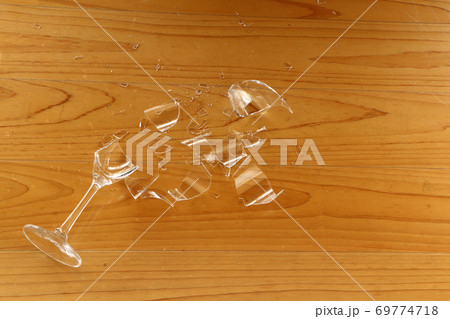 broken wine glass on floor