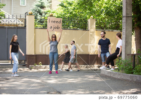 Dude with sign - woman stands protesting things that annoy him Dude with sign - woman stands protesting things that annoy him 69775060