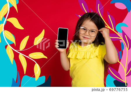 Asian little girl portrait isolated on bright, modern illustrated background. Asian little girl portrait isolated on bright, modern illustrated background. 69776755