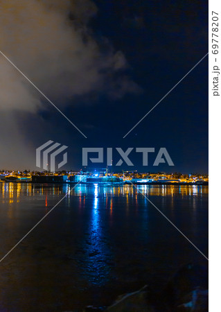 Night photo of Reykjavik city beach. Waterfront lights Night photo of Reykjavik city beach. Waterfront lights 69778207
