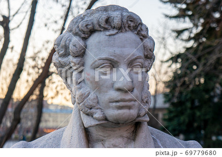 Moscow, Russia - March 24, 2020: Monument to the great Russian poet Alexander Pushkin on the background of trees Moscow, Russia - March 24, 2020: Monument to the great Russian poet Alexander Pushkin on the background of trees 69779680