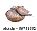 dried (one-sun) marinated butterfly silver barb in bamboo basket with white background 69781662