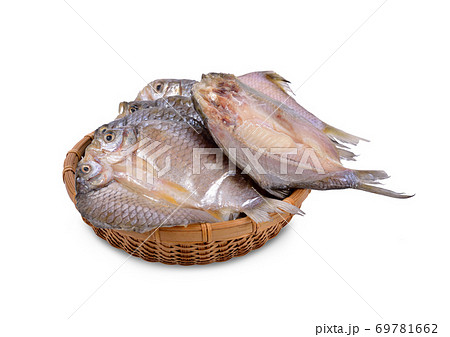 dried (one-sun) marinated butterfly silver barb in bamboo basket with white background 69781662