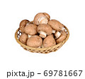 fresh champignon mushroom in bamboo basket on white background 69781667