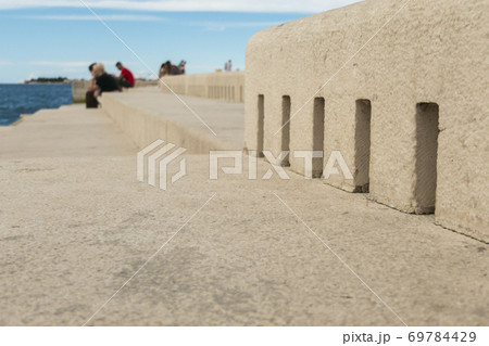 People sitting by Sea Organ People sitting by Sea Organ 69784429