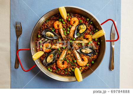 Spanish rice dish paella with seafood in a pan 69784888