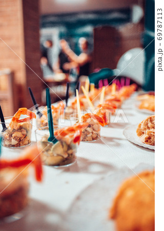 Table full of food at a party 69787113