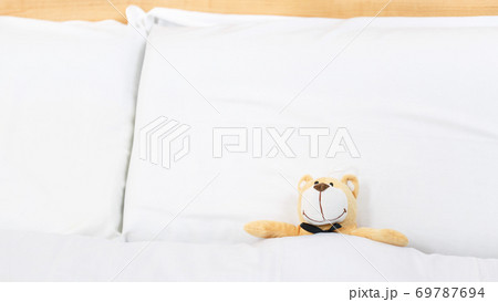 teddy bear on an empty clean bed teddy bear on an empty clean bed 69787694