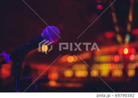 Close up of microphone in concert hall or conference room. Close up of microphone in concert hall or conference room. 69790382