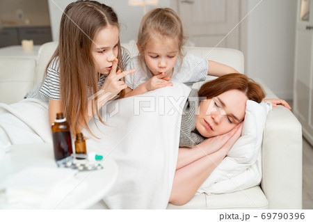 daughters do not interfere with sick mom sleep. 69790396