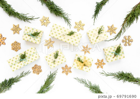 Christmas or new year texture. Christmas decorations in gold colors on white background. Holiday and celebration concept. Top view. Flat lay Christmas or new year texture. Christmas decorations in gold colors on white background. Holiday and celebration concept. Top view. Flat lay 69791690