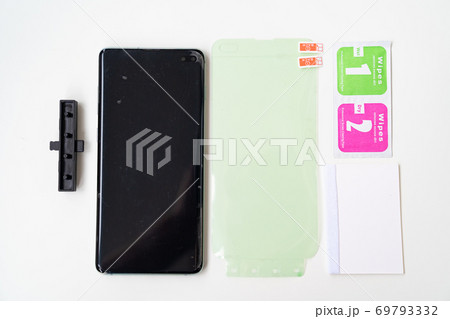 screen protector or glass cover. black smartphone. screen protector or glass cover. black smartphone. 69793332