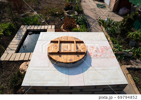 aboveground large brick tandir oven in the garden. aboveground large brick tandir oven in the garden. 69794852