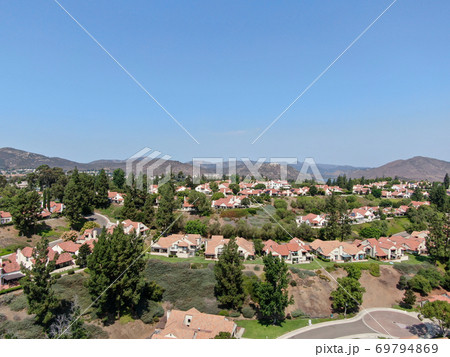 Aerial view of middle class neighborhood with residential house community, San Diego 69794869