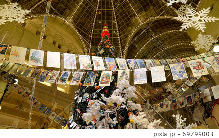 Interior Main Universal Store (GUM) in the Christmas (New Year) holidays, Red Square, Moscow, Russia. Inscriptions in Russian GUM and Happy New Year 69799003