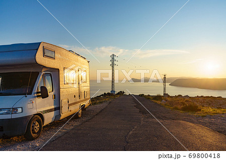 Caravan on coast at sunset, Spain Caravan on coast at sunset, Spain 69800418