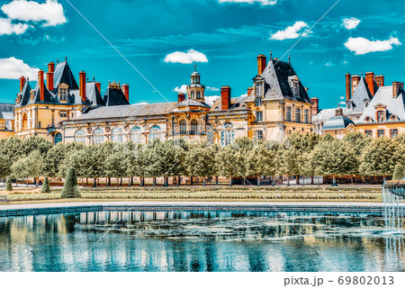 Suburban Residence of the France Kings - beautiful Chateau Fontainebleau with the fountain on foreground. Suburban Residence of the France Kings - beautiful Chateau Fontainebleau with the fountain on foreground. 69802013