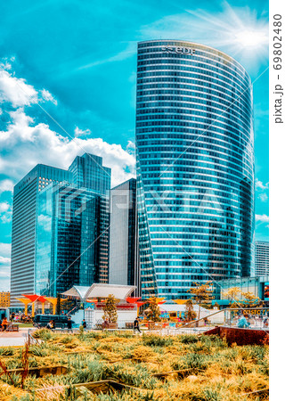PARIS, FRANCE - JULY 06, 2016 :La Defense, Business Quarter with businessmen in the streets, area of Paris, French financial center with skyscrapers and modern buildings. PARIS, FRANCE - JULY 06, 2016 :La Defense, Business Quarter with businessmen in the streets, area of Paris, French financial center with skyscrapers and modern buildings. 69802480
