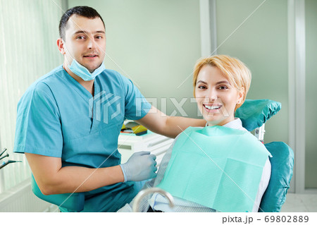 Dentist and patient are smiling Dentist and patient are smiling 69802889
