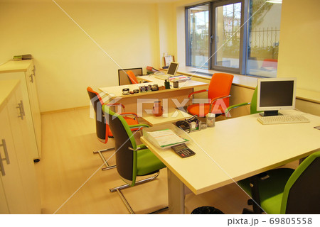 Modern and empty office, tables and chairs in the Modern and empty office, tables and chairs in the 69805558